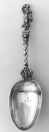   Douwe Klazes Compaan 1809 Memorielepel De lepel is bekroond met een allegorische voorstelling van de Ijdelheid. Merken: Meesterteken C in cirkel. 10 = gehaltekeur voor 10 penningen. Wapen Heerenveen in ovaal. Jaarletter b= 1809.